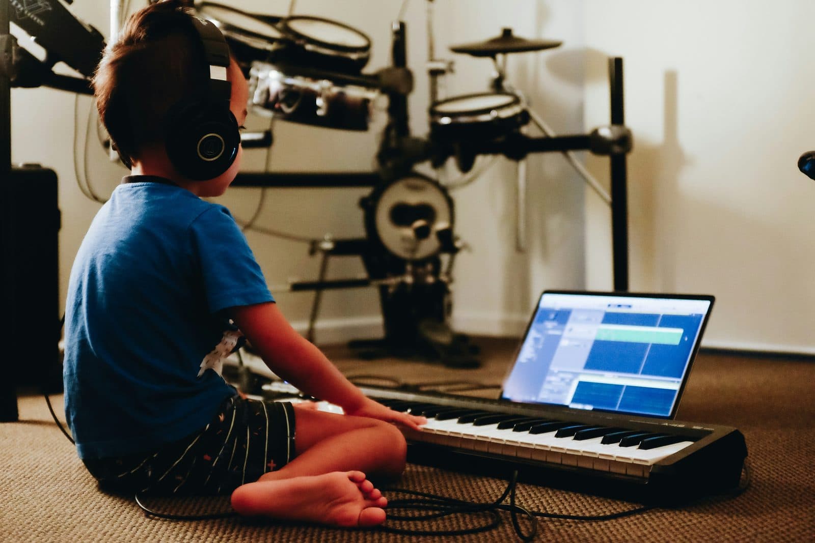 A child exploring music with a keyboard